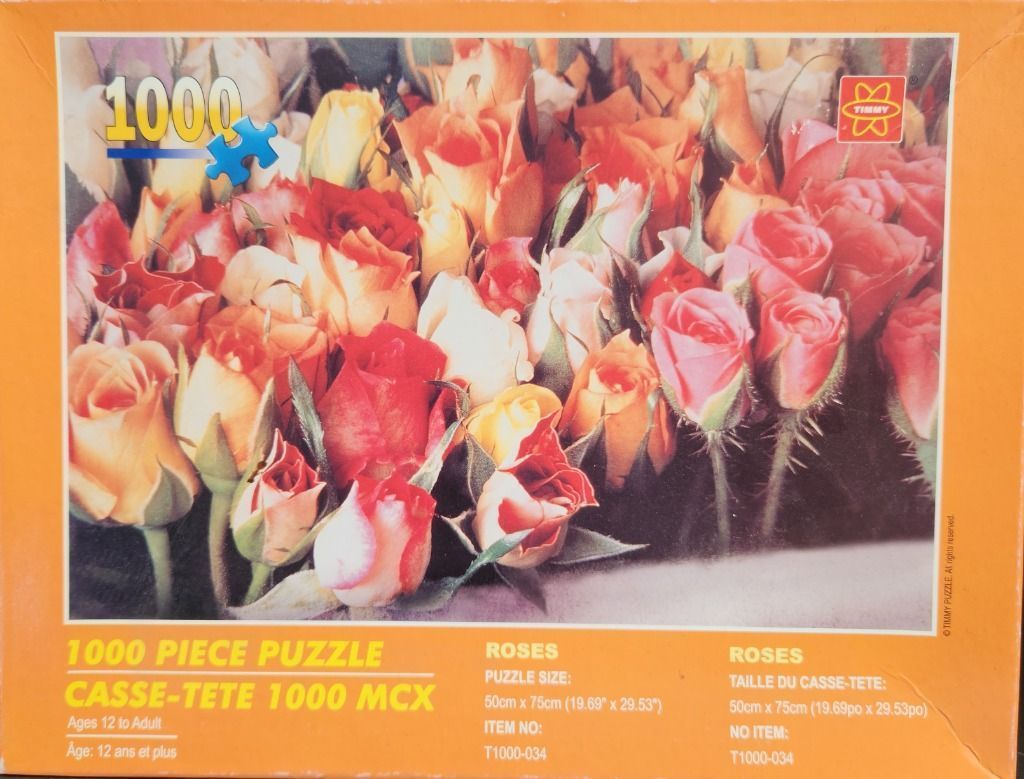 A close-up photograph of a dense bouquet of multi-colored roses in shades of red, pink, orange, and cream.