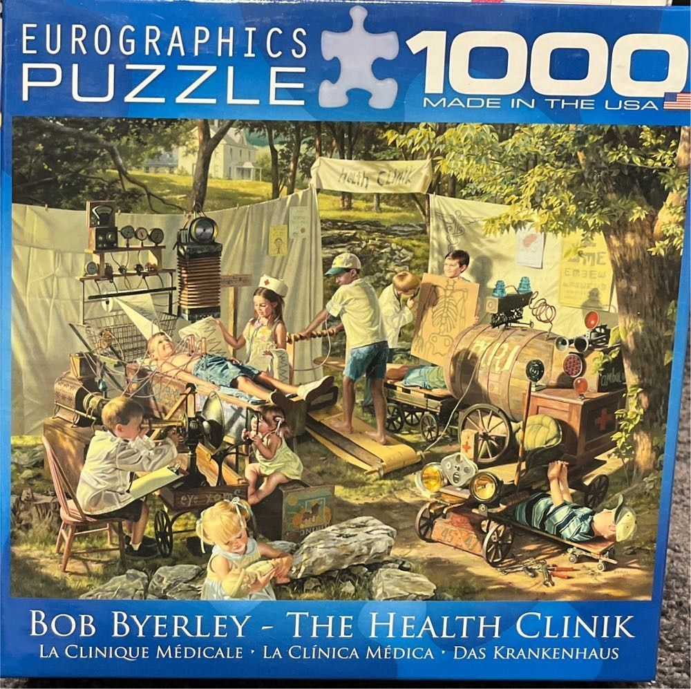 Children playing doctor in an outdoor makeshift clinic by Bob Byerley