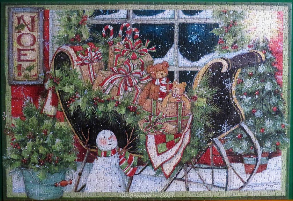 A nostalgic Christmas scene featuring a black sleigh filled with gifts, a snowman, and a snowy window background.