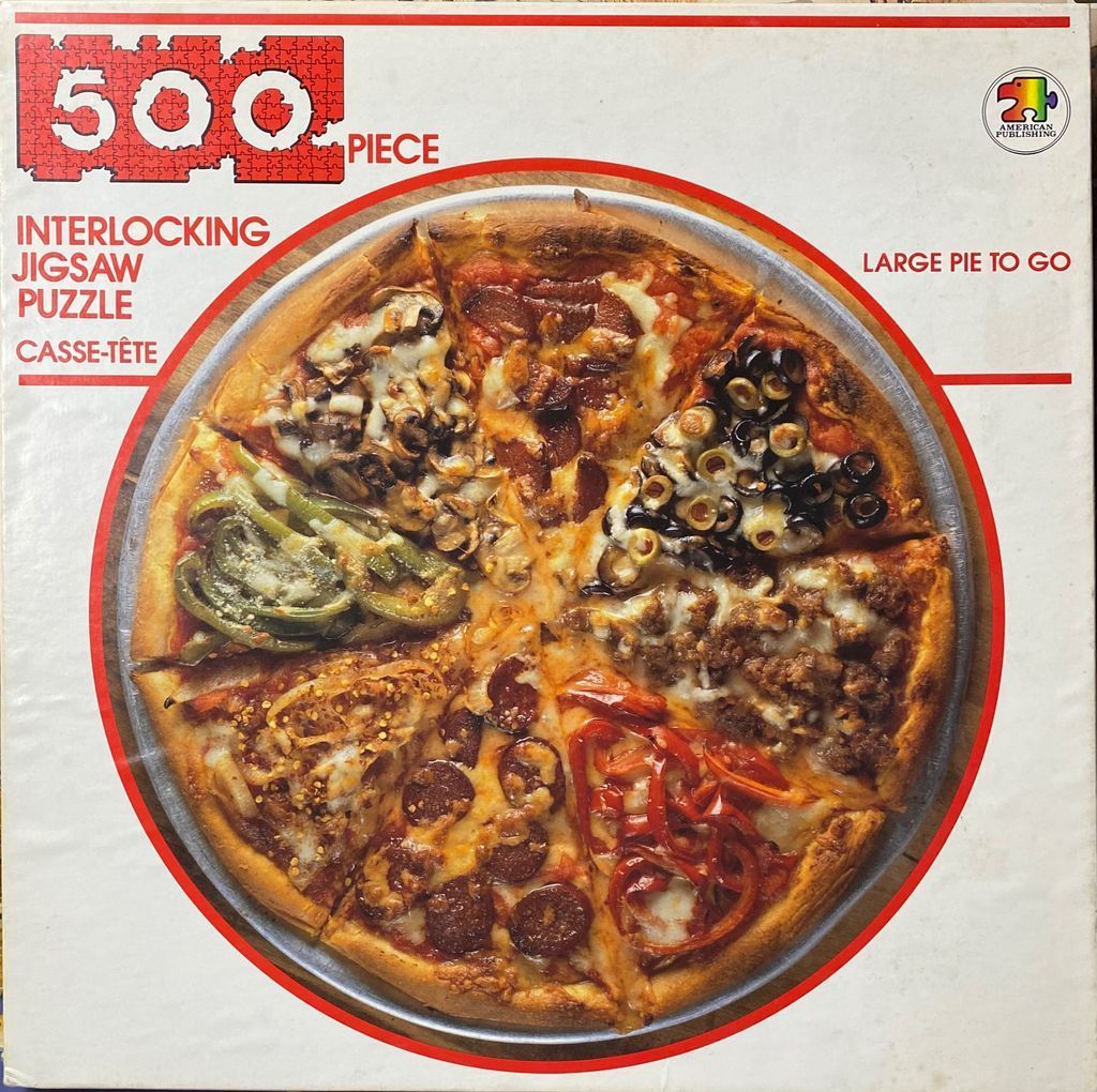 A top-down photographic view of a large round pizza divided into six distinct triangular slices of different toppings.