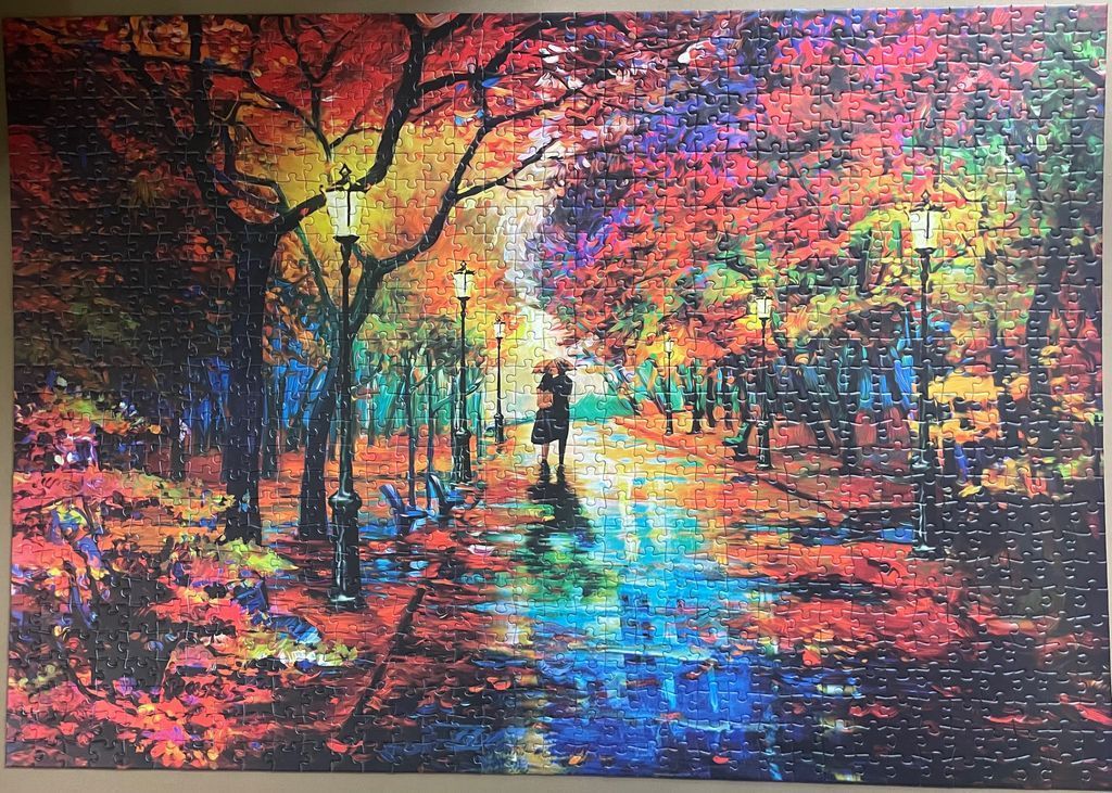 A couple walking under an umbrella down an autumnal park pathway lit by streetlamps in an impressionist style.