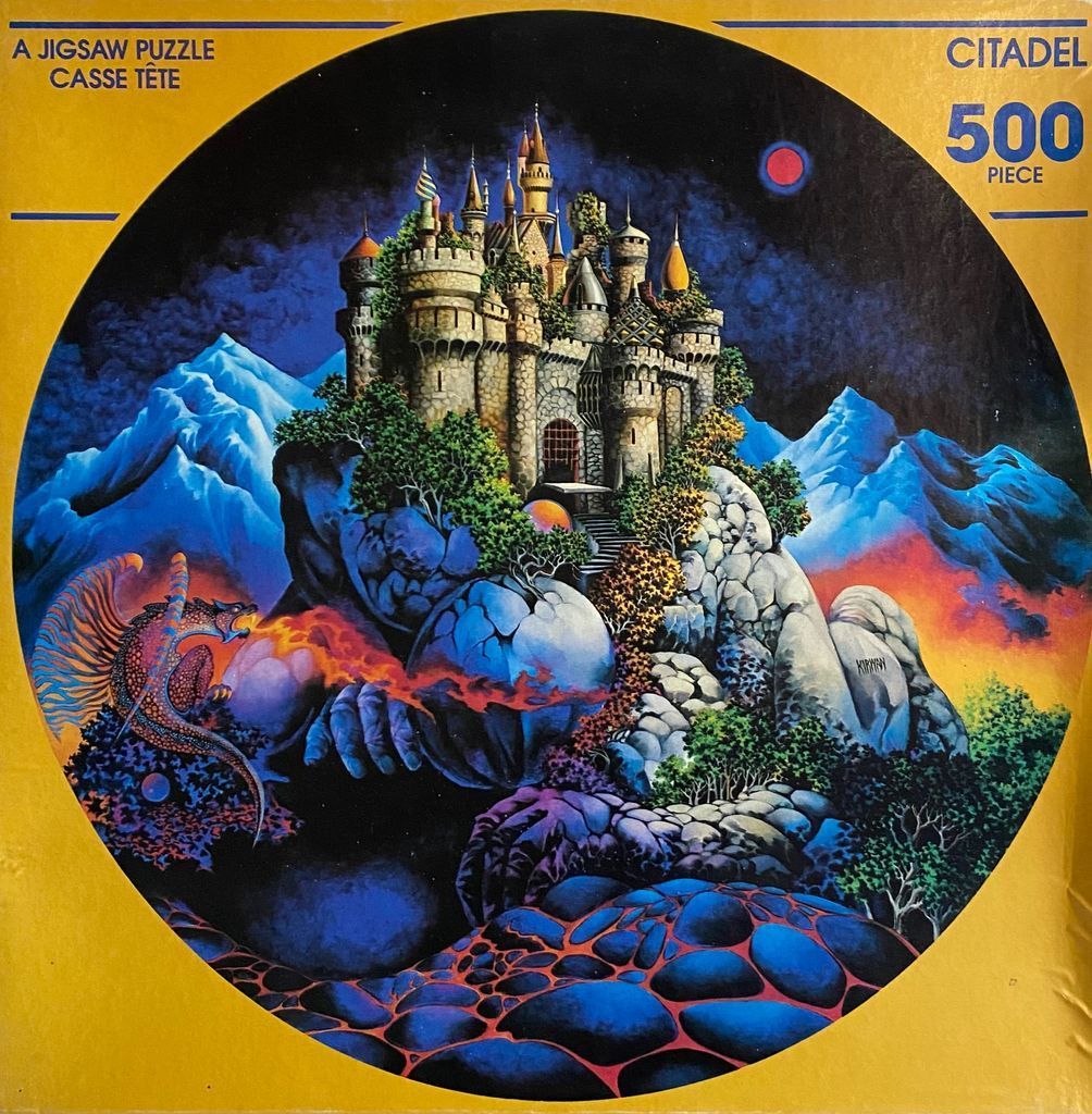 A fantasy illustration of a castle atop a rocky peak with a dragon breathing fire in the foreground.