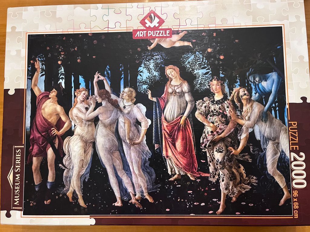 A reproduction of Sandro Botticelli's Primavera painting featuring mythological figures in a dark grove.