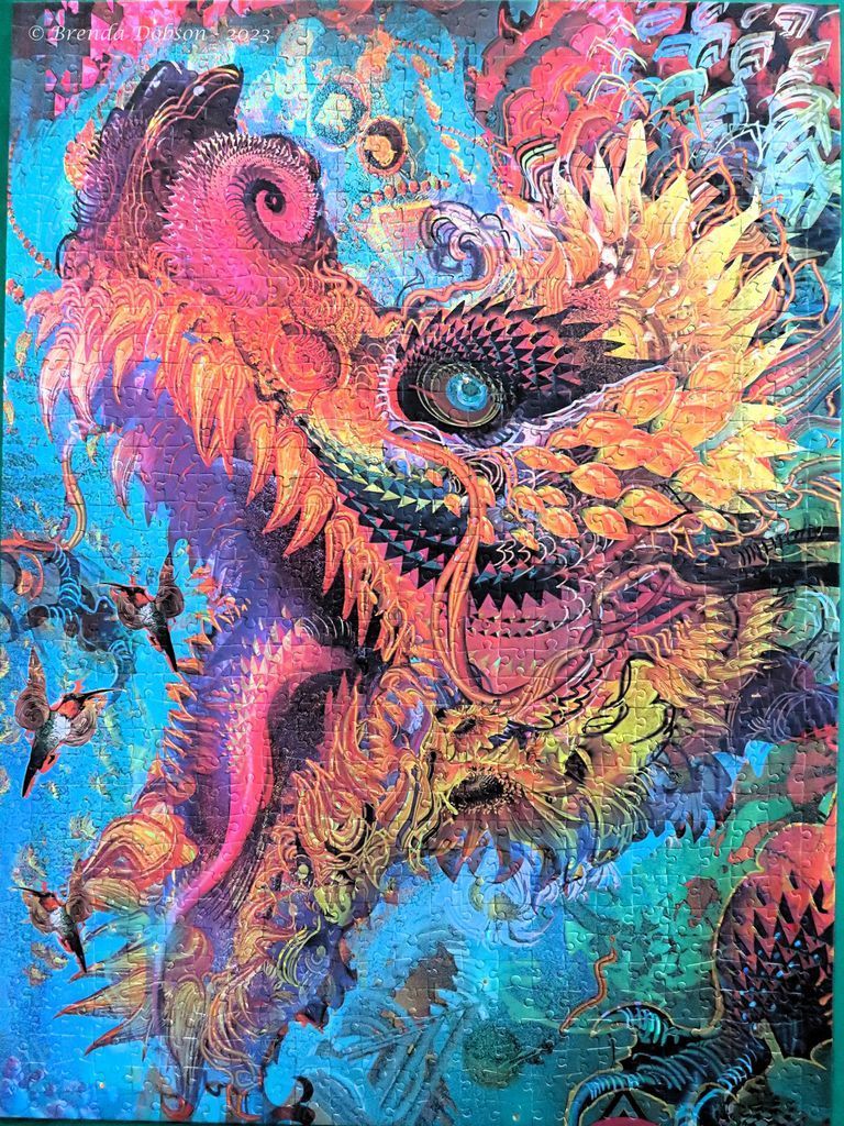 Intricate, vibrant digital illustration of a stylized dragon head in pink, orange, and blue hues.