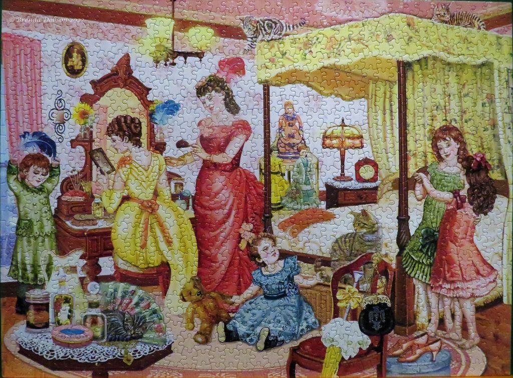 An illustration of an ornate Victorian bedroom filled with women and children, toys, and cats.