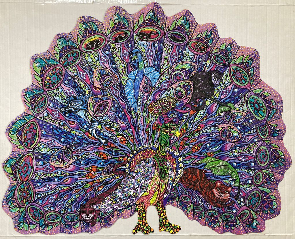 An intricately detailed illustration of a peacock with a vibrant, fan-shaped tail filled with hidden animals and patterns.