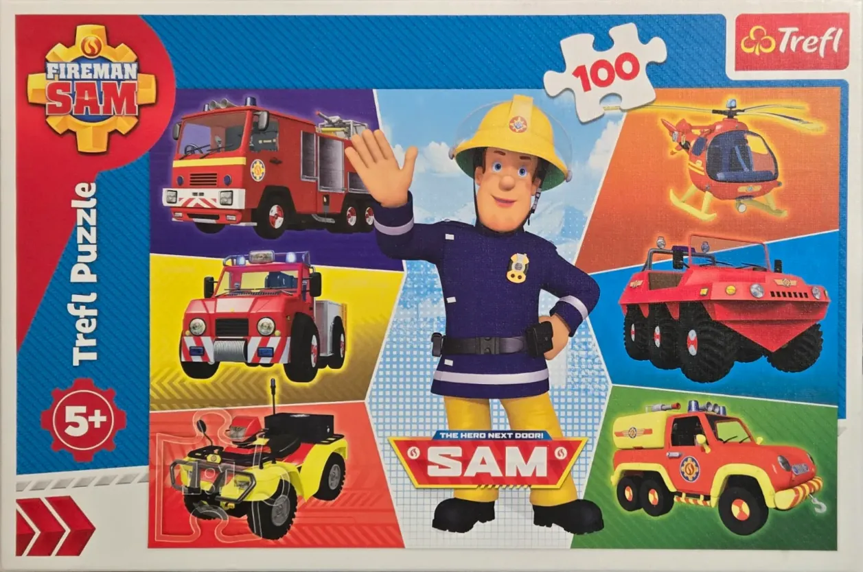 Fireman Sam waving with his rescue vehicles, including a fire truck, helicopter, and various emergency cars.