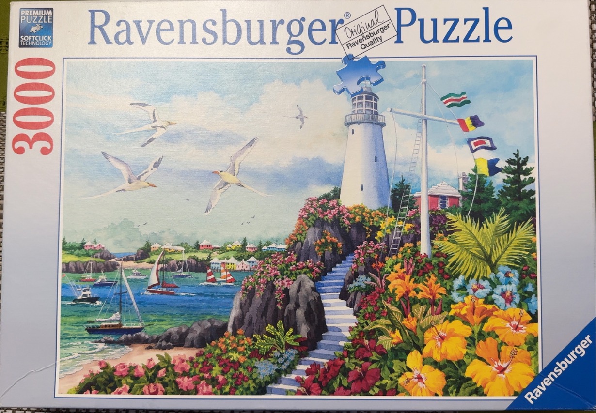 A lighthouse scene with colorful flowers, a staircase, and sailboats in a coastal harbour.