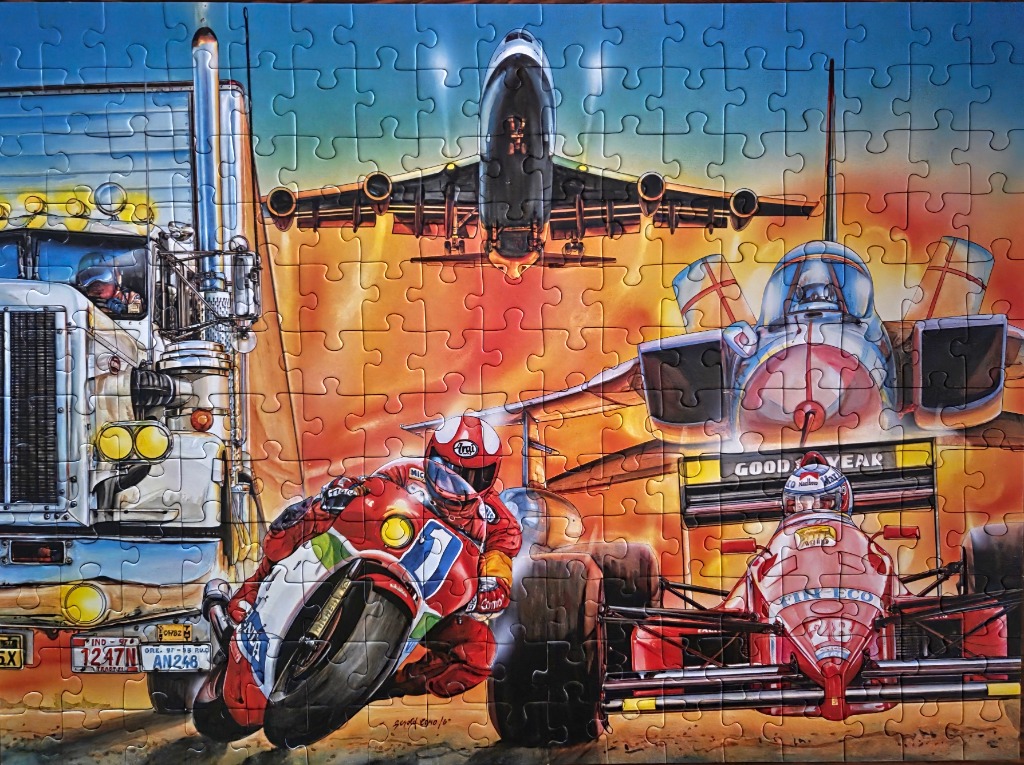 A dynamic illustration featuring a large truck, a racing motorcycle, a Formula One car, and a jet plane against a sunset.