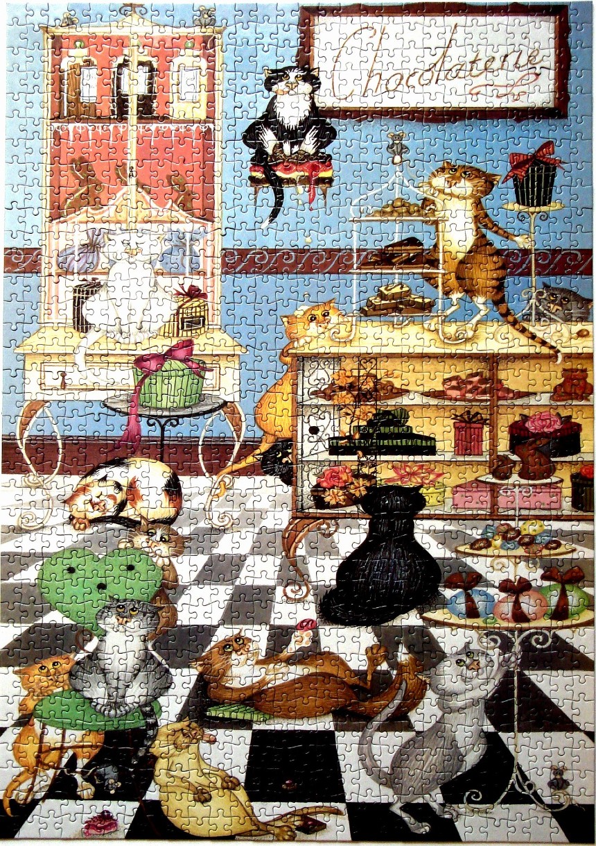 Whimsical illustration of numerous cats exploring and playing in a chocolate shop.