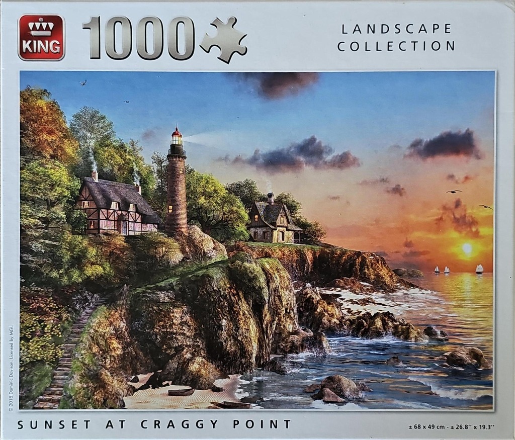 A coastal lighthouse and two stone cottages perched on a rocky cliff overlooking the sea at sunset.