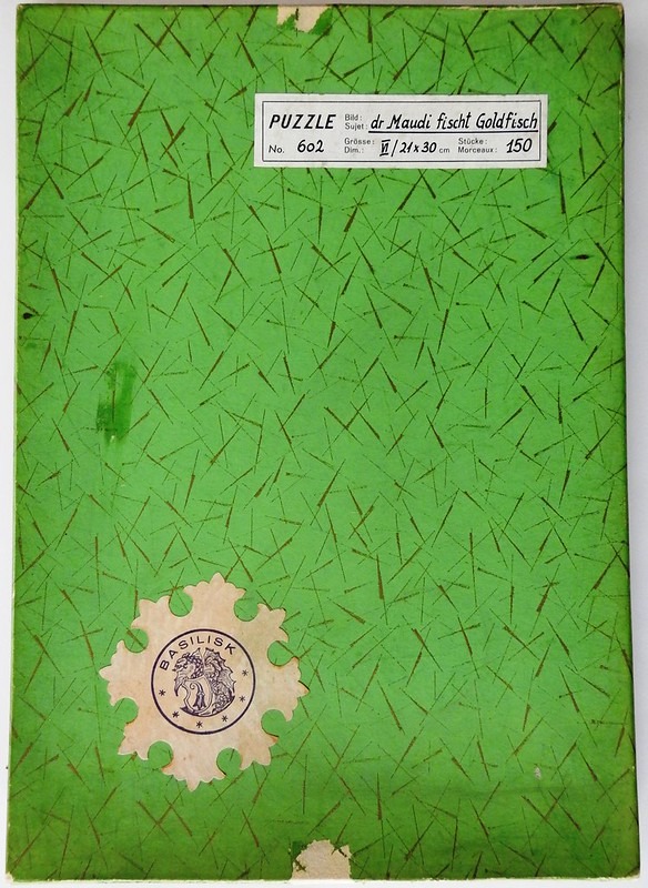 Bright green background with a scattered pattern of dark lines and two white labels, one rectangular and one scalloped.