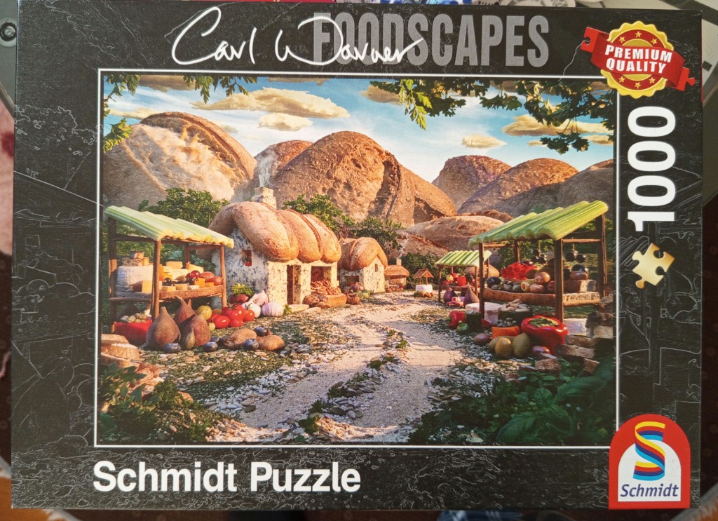 A whimsical landscape scene constructed entirely from bread, vegetables, and fruit.