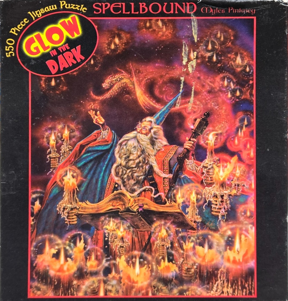 A fantasy illustration of a wizard reading from a glowing book surrounded by many candles and a spectral dragon.