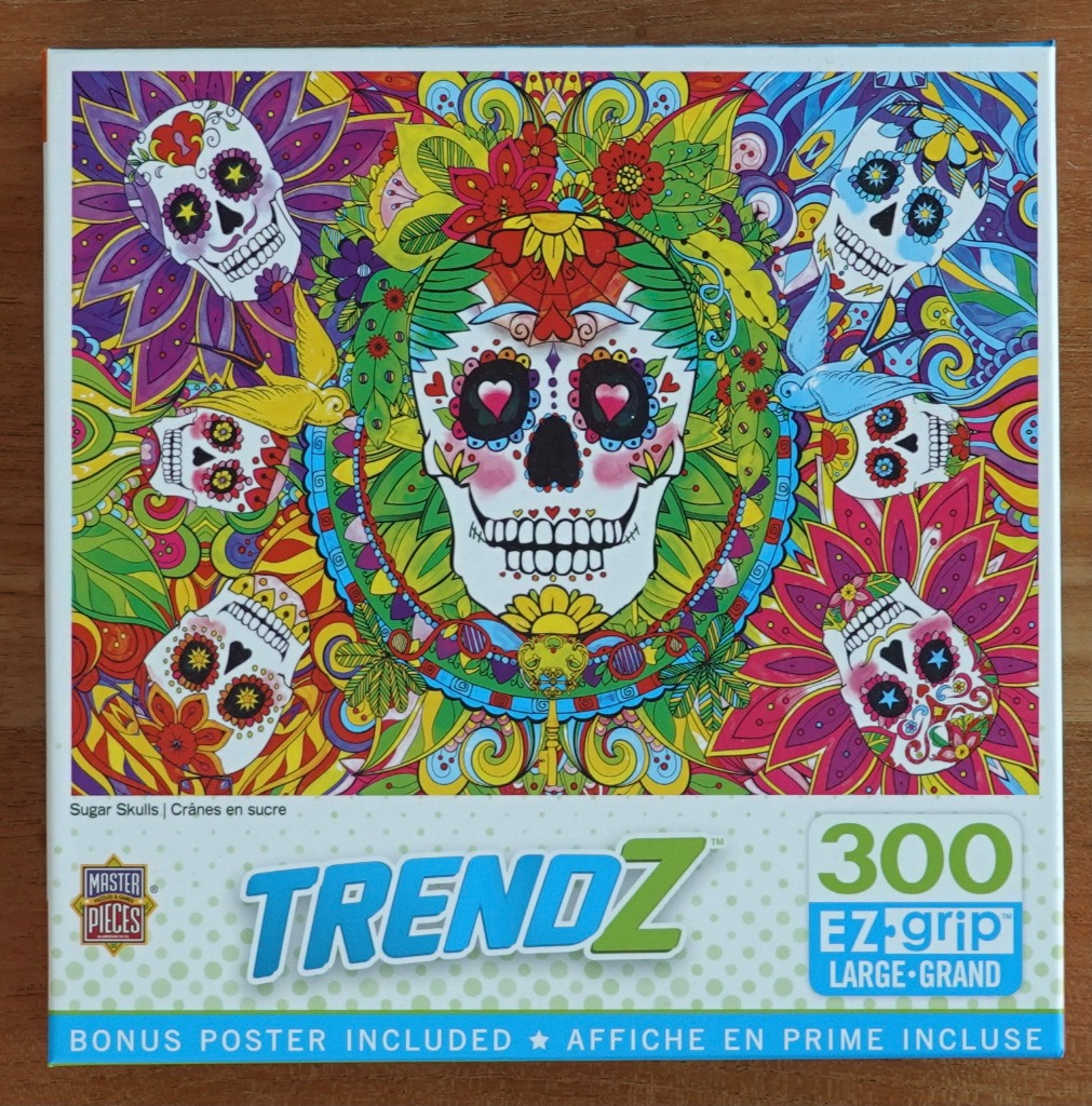 A vibrant, kaleidoscopic illustration of five sugar skulls surrounded by intricate floral and paisley patterns.