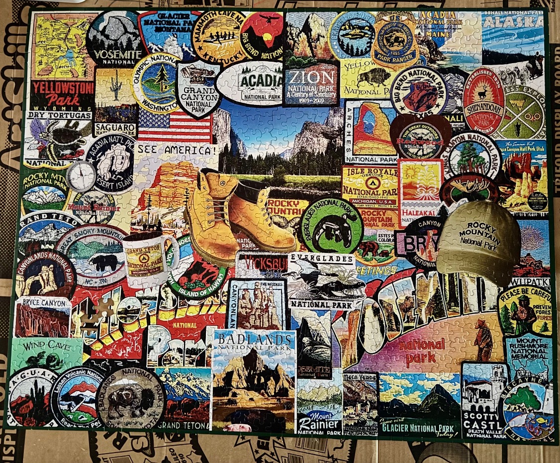 A collage of vintage-style national park souvenir patches, stickers, and memorabilia.