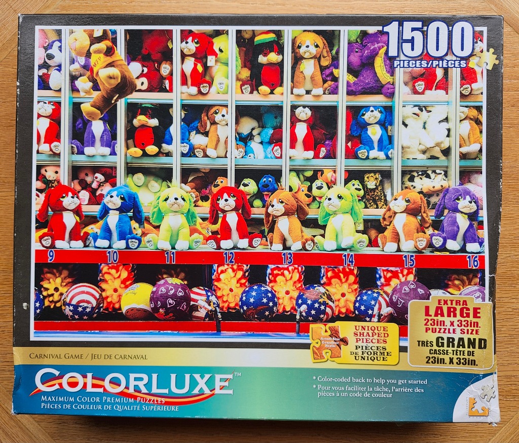 A collection of colorful stuffed puppies and carnival balls displayed on shelves in a carnival game booth.