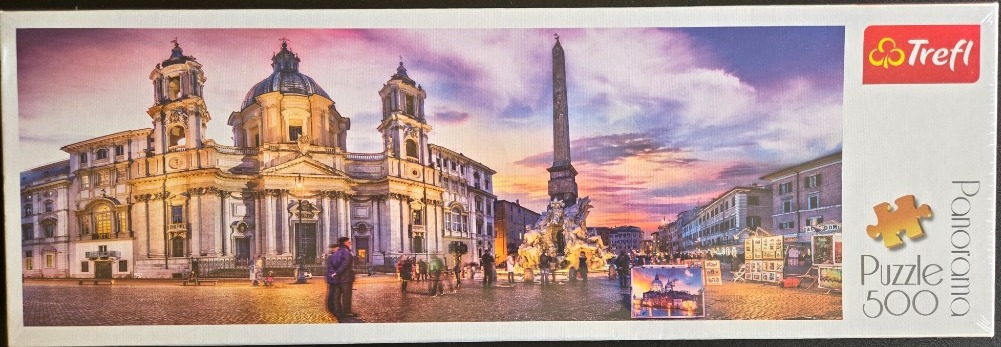 A panoramic view of Piazza Navona in Rome at sunset, featuring Sant