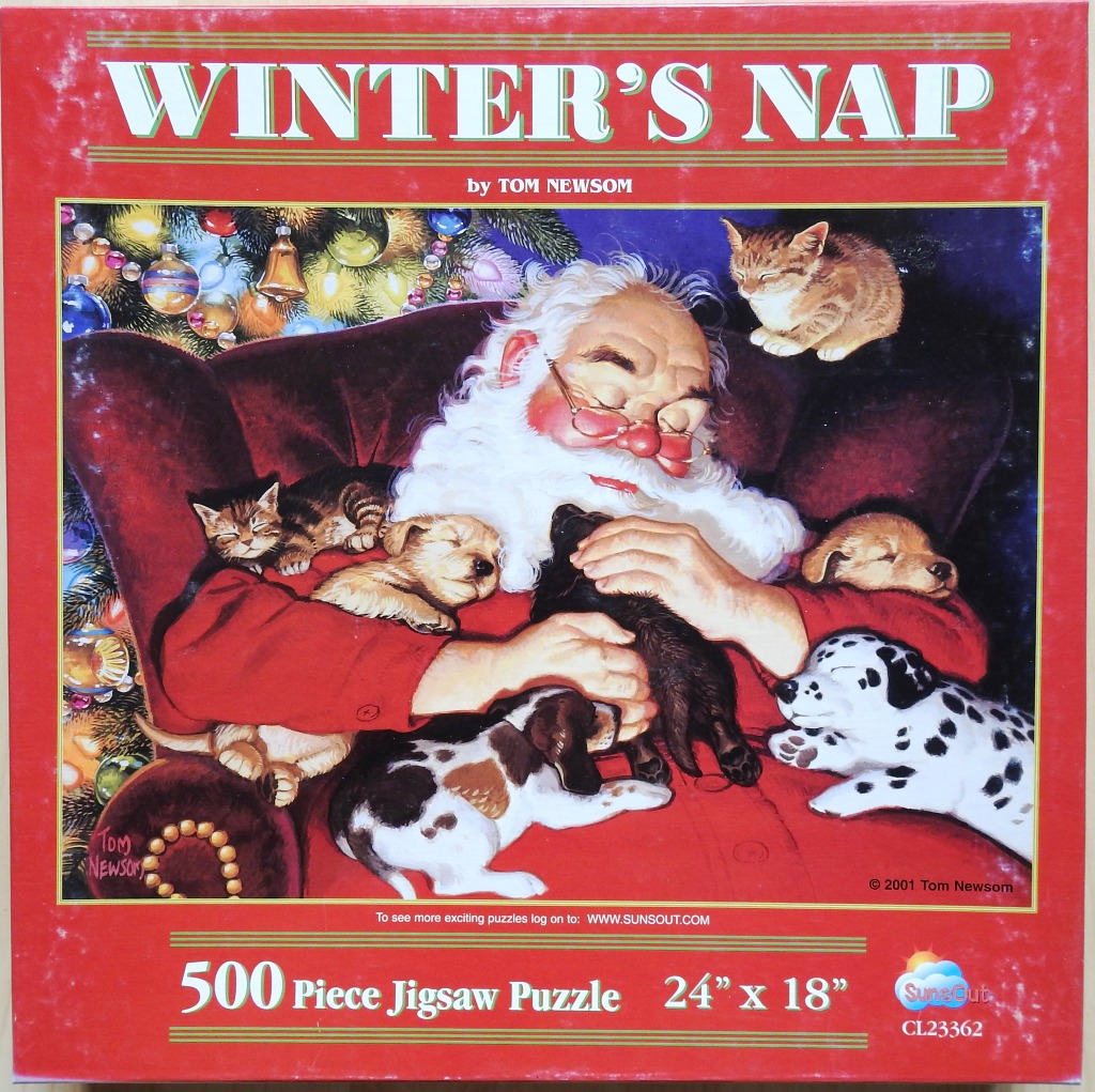 Santa Claus asleep in an armchair surrounded by five puppies and a kitten under a decorated Christmas tree.