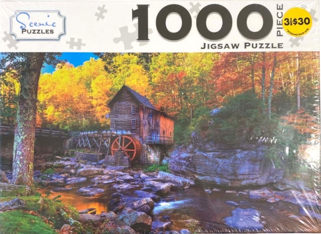 A rustic wooden watermill sits on a rocky stream surrounded by vibrant autumn trees.