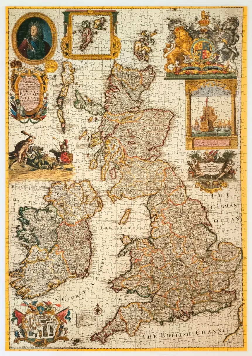 An antique-style illustrated map of Great Britain and Ireland surrounded by elaborate decorative cartouches.