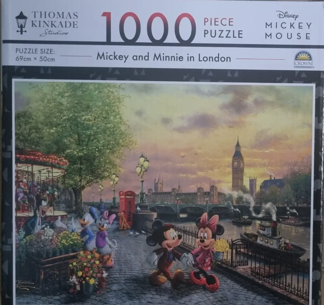 Mickey and Minnie Mouse walking hand-in-hand along the Thames in London with Big Ben in the background.