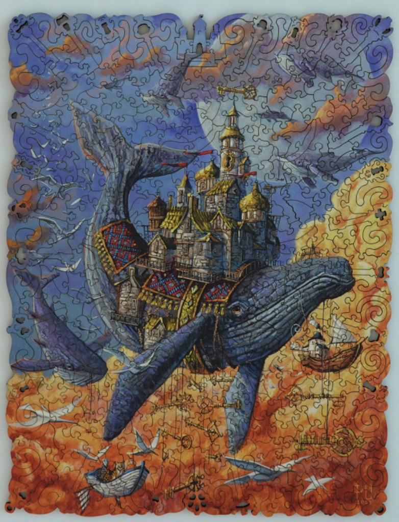 A whimsical illustration of a city built on the back of a giant whale floating in a sunset sky.