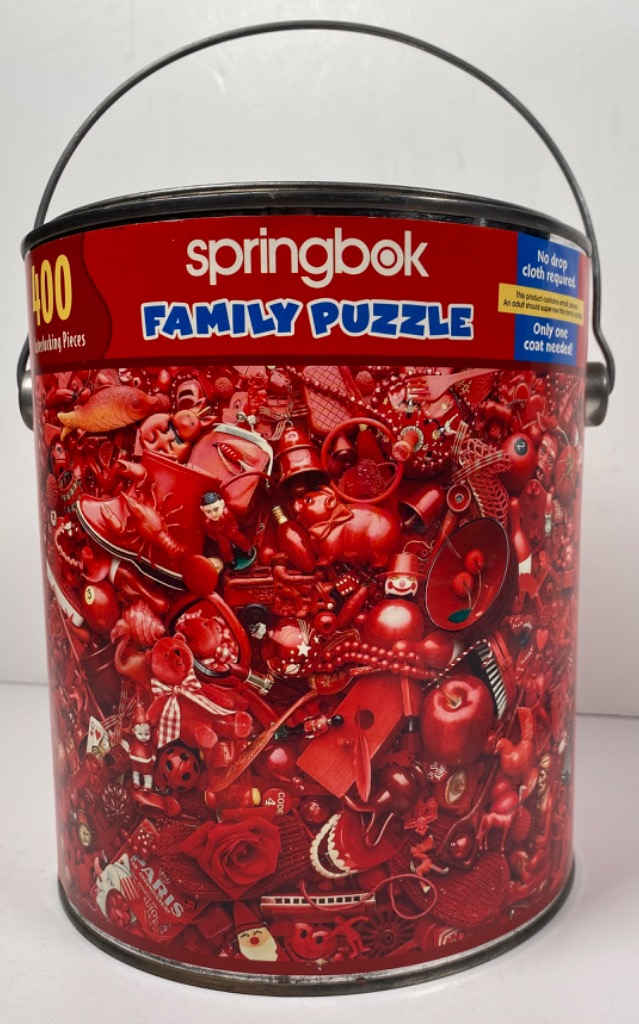 A collection of miscellaneous objects colored entirely in shades of bright red, tightly packed into a dense collage.