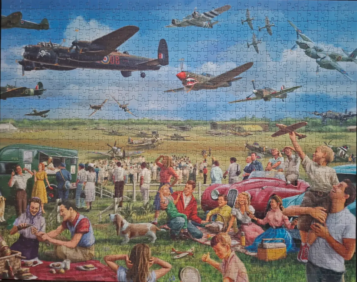 A nostalgic painting of families at an air show watching vintage military aircraft flying overhead.