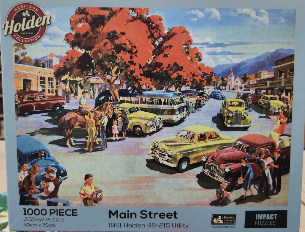 Vintage painting of a busy 1950s town street with classic cars, a horse, and shoppers.