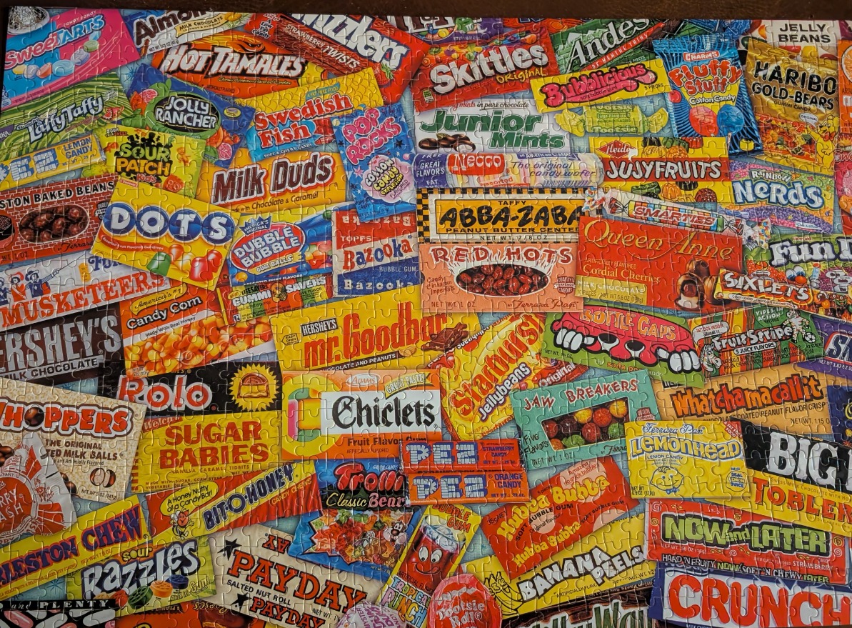 A collage of various classic candy bar and snack packaging labels.