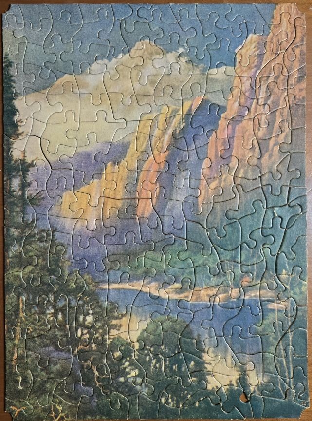 A vintage-style illustration of a mountain valley with a lake in the foreground.