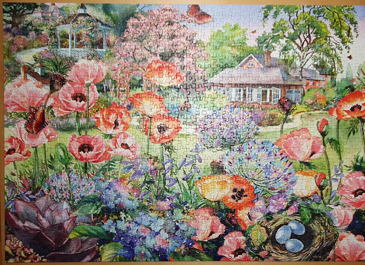 A lush, impressionistic garden filled with blooming poppies, a gazebo, and a bird's nest with blue eggs.