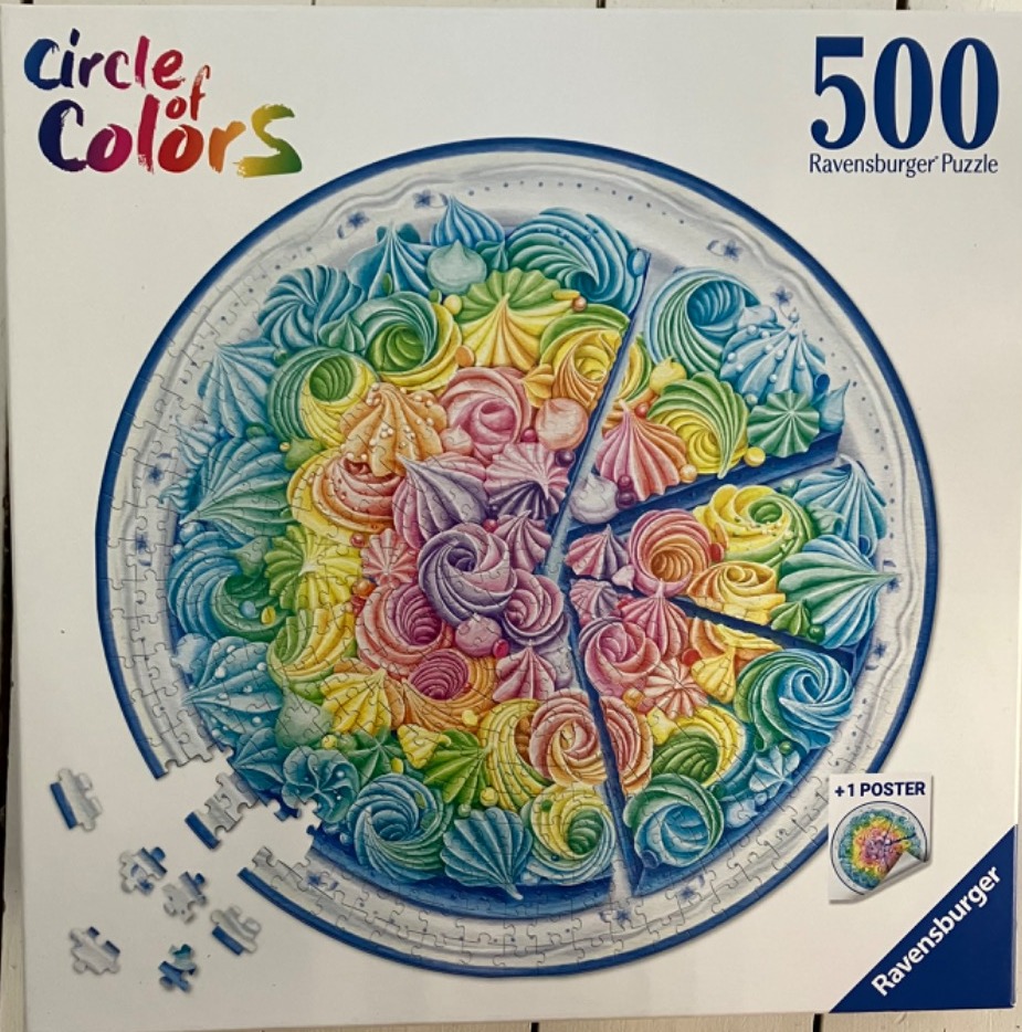 A circular illustration of a colorful cake decorated with piped frosting swirls in a rainbow spectrum.