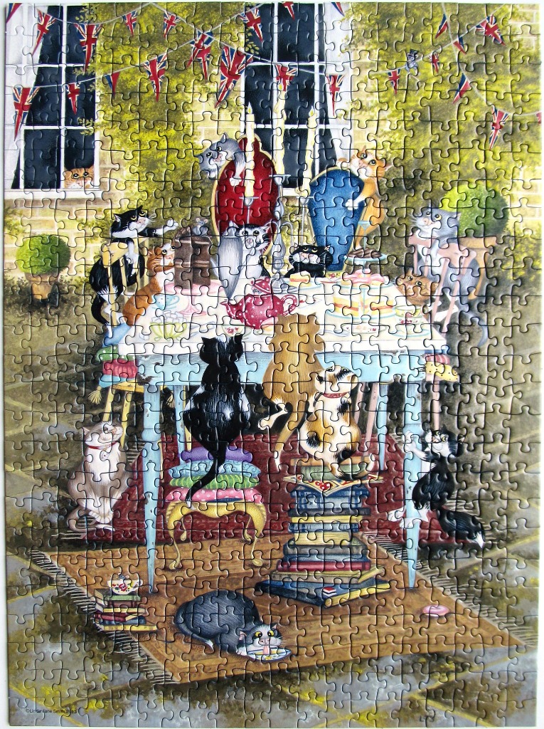 An illustration of many cats gathered around a table for a garden tea party decorated with British bunting.