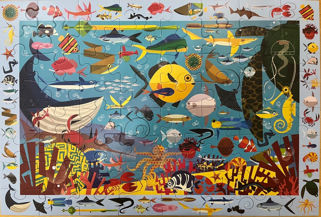 A whimsical illustration of various sea creatures in a stylized underwater scene with a border of small icons.