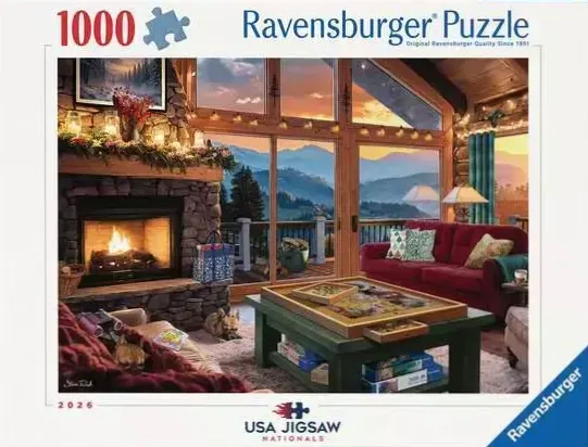 A cozy rustic living room featuring a stone fireplace, a red sofa, and a scenic mountain view at sunset through large windows
