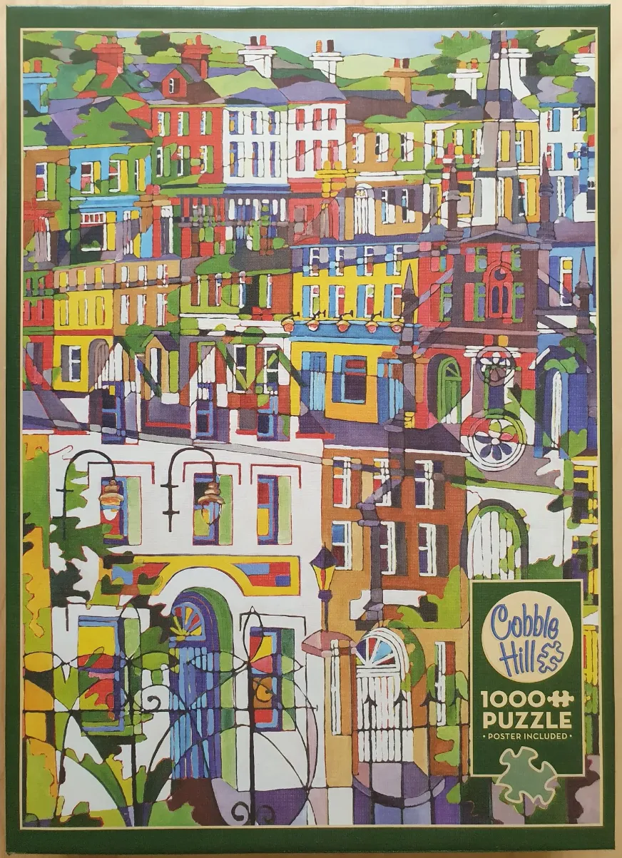 Colorful, stylized painting of a dense European-style hillside town with vibrant, segmented building facades.