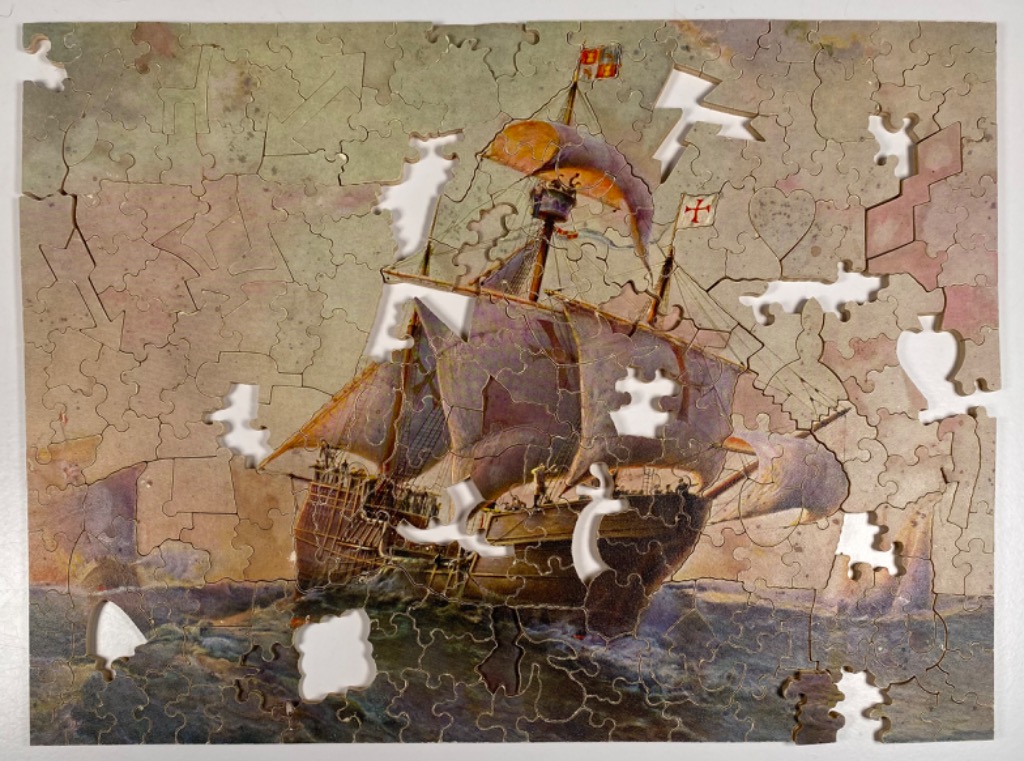 Historical sailing ship on a turbulent, muted-toned ocean under a clouded sky.