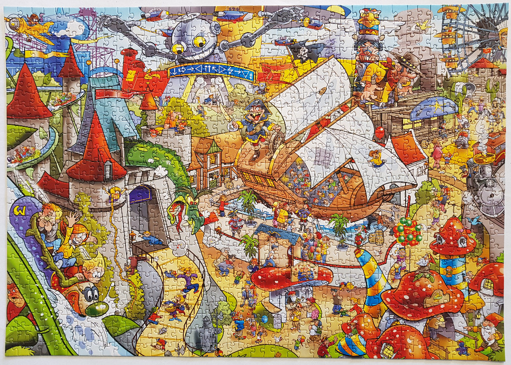 Cartoon amusement park scene with a pirate ship, roller coaster, and fairytale castle
