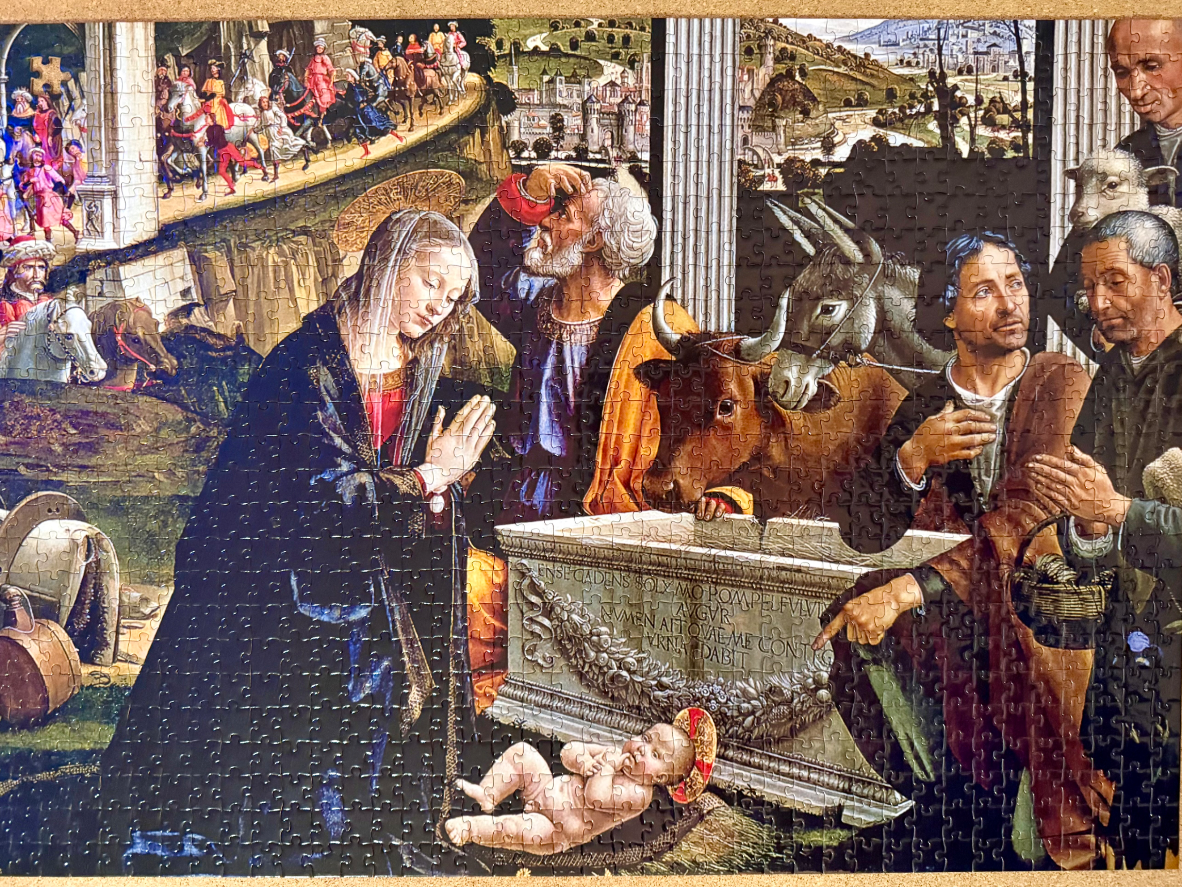 A Renaissance-style nativity painting featuring the Virgin Mary, Joseph, and an infant Jesus before a stone sarcophagus.
