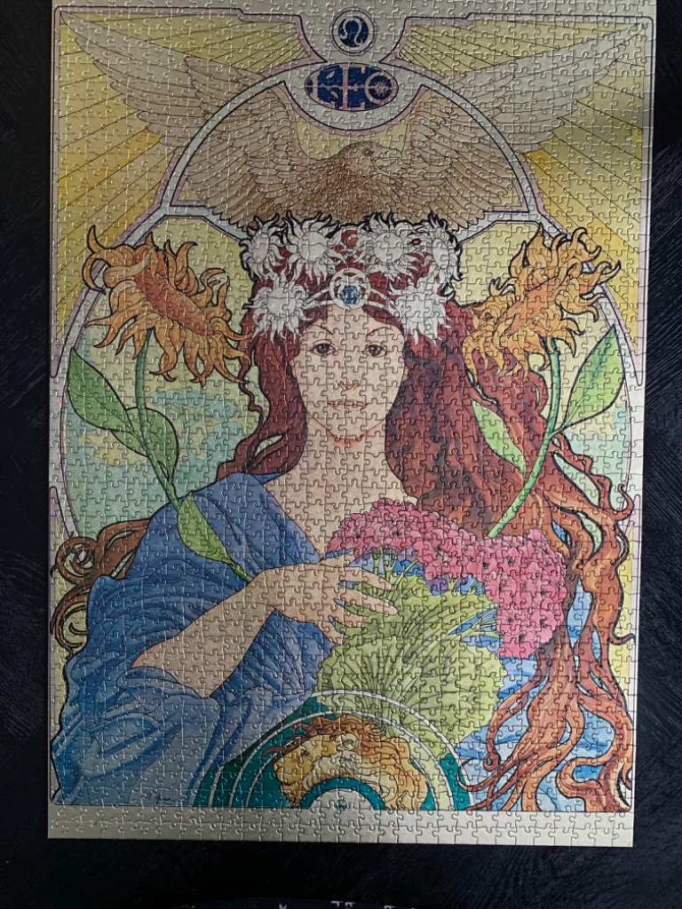 Art Nouveau style illustration of a woman wearing a crown of suns with sunflowers and an eagle above her.