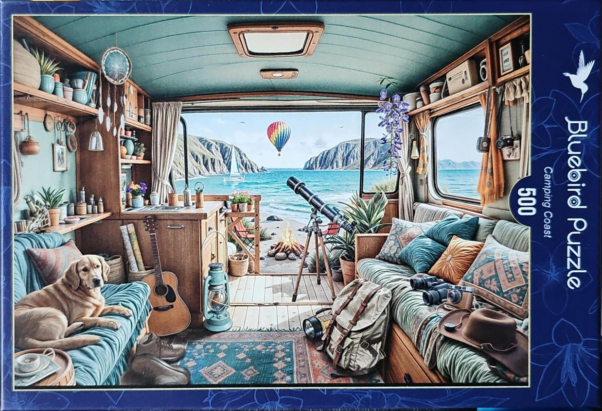 A cozy camper interior looking out onto a sunny coastal beach scene with a dog, guitar, telescope, and hot air balloon.