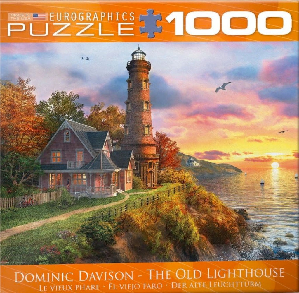 A lighthouse and coastal home at sunset with autumn foliage