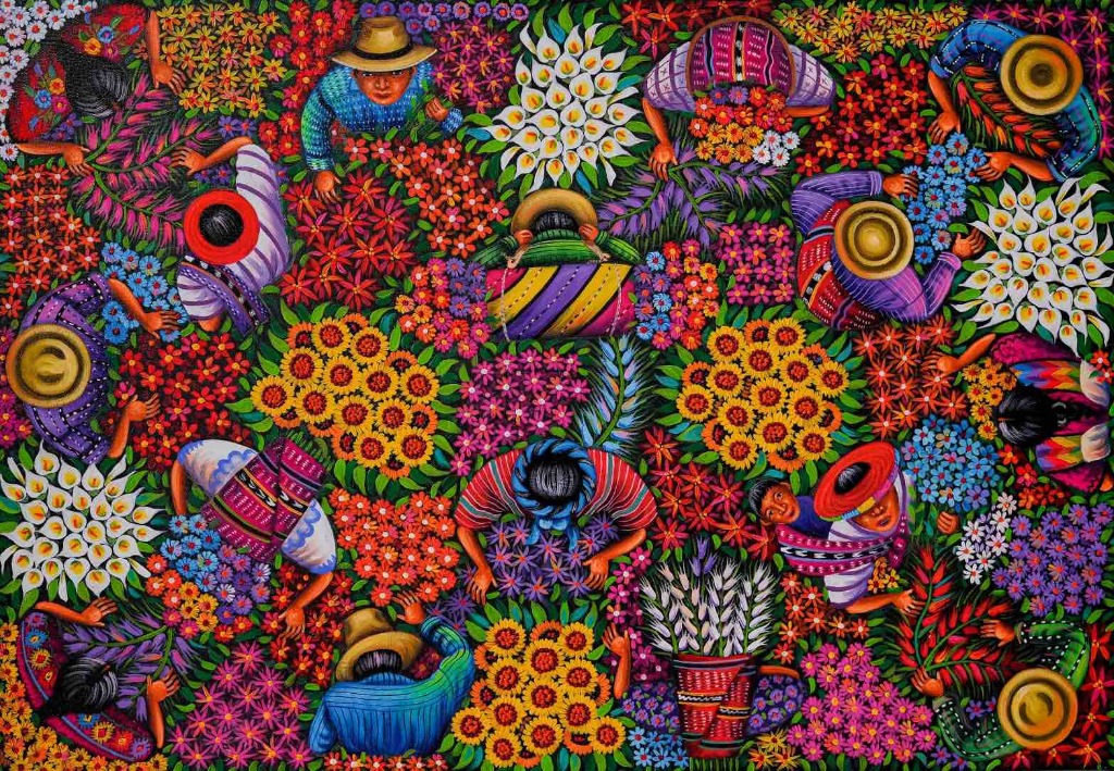 An overhead view of people harvesting and gathering a dense, vibrant sea of flowers.