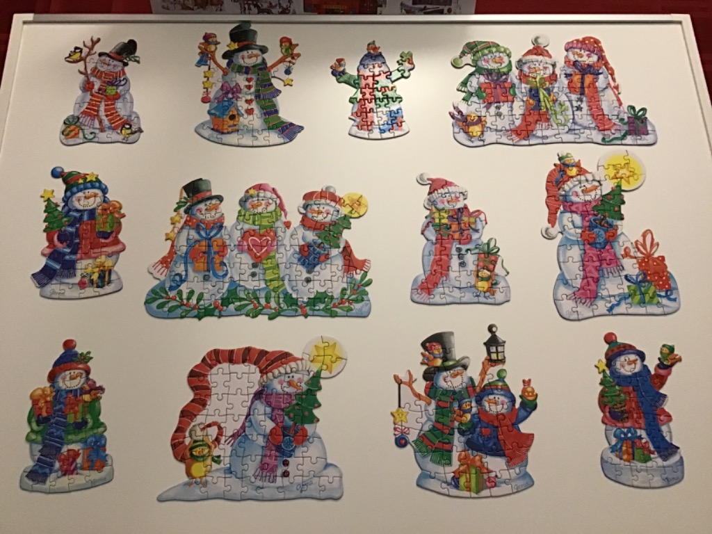 A collection of twelve festive snowman illustrations with colorful scarves, hats, and holiday accessories.