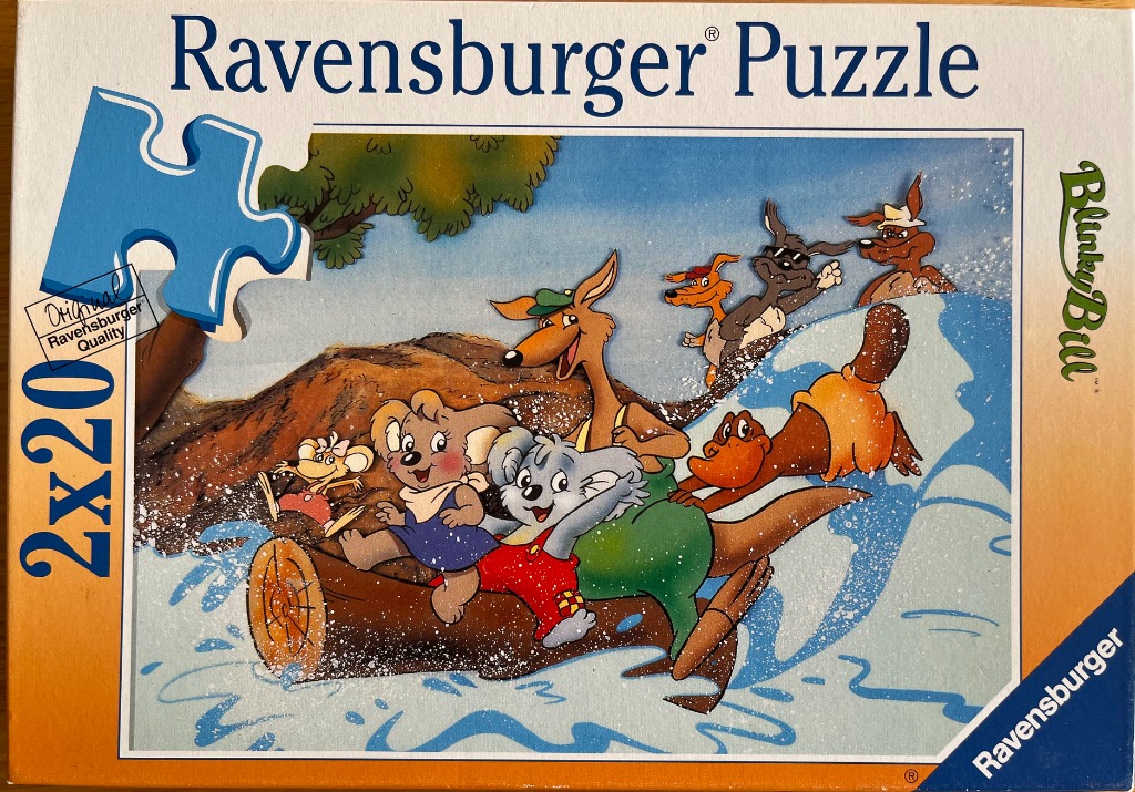 Animated characters Blinky Bill and friends riding a log down a river.