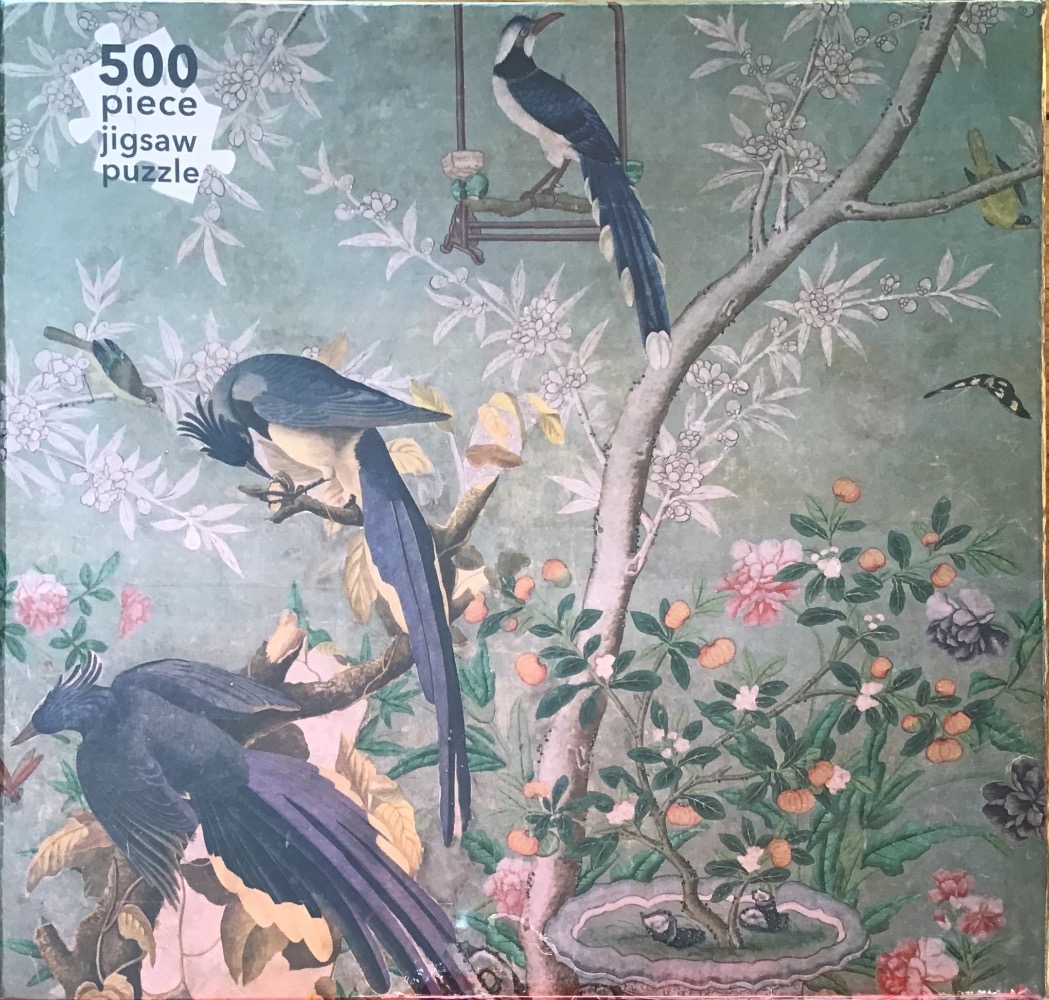 An illustration of blue, crested birds perched on flowering branches against a soft sage green background.