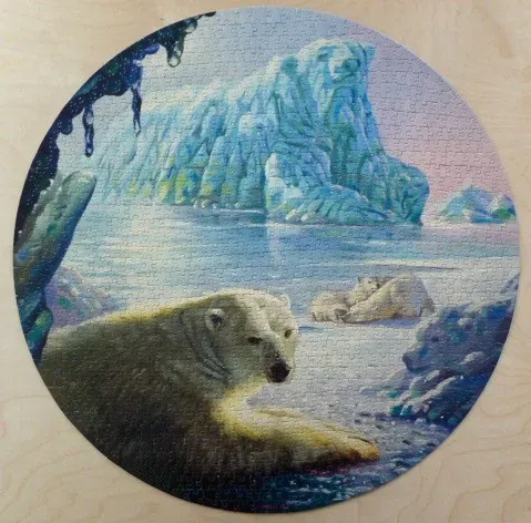 A circular illustration of polar bears resting in a glacial arctic landscape.