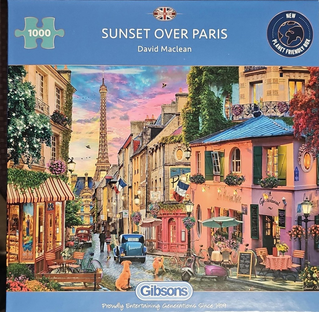 Illustration of a Parisian street scene at sunset with the Eiffel Tower in the distance.